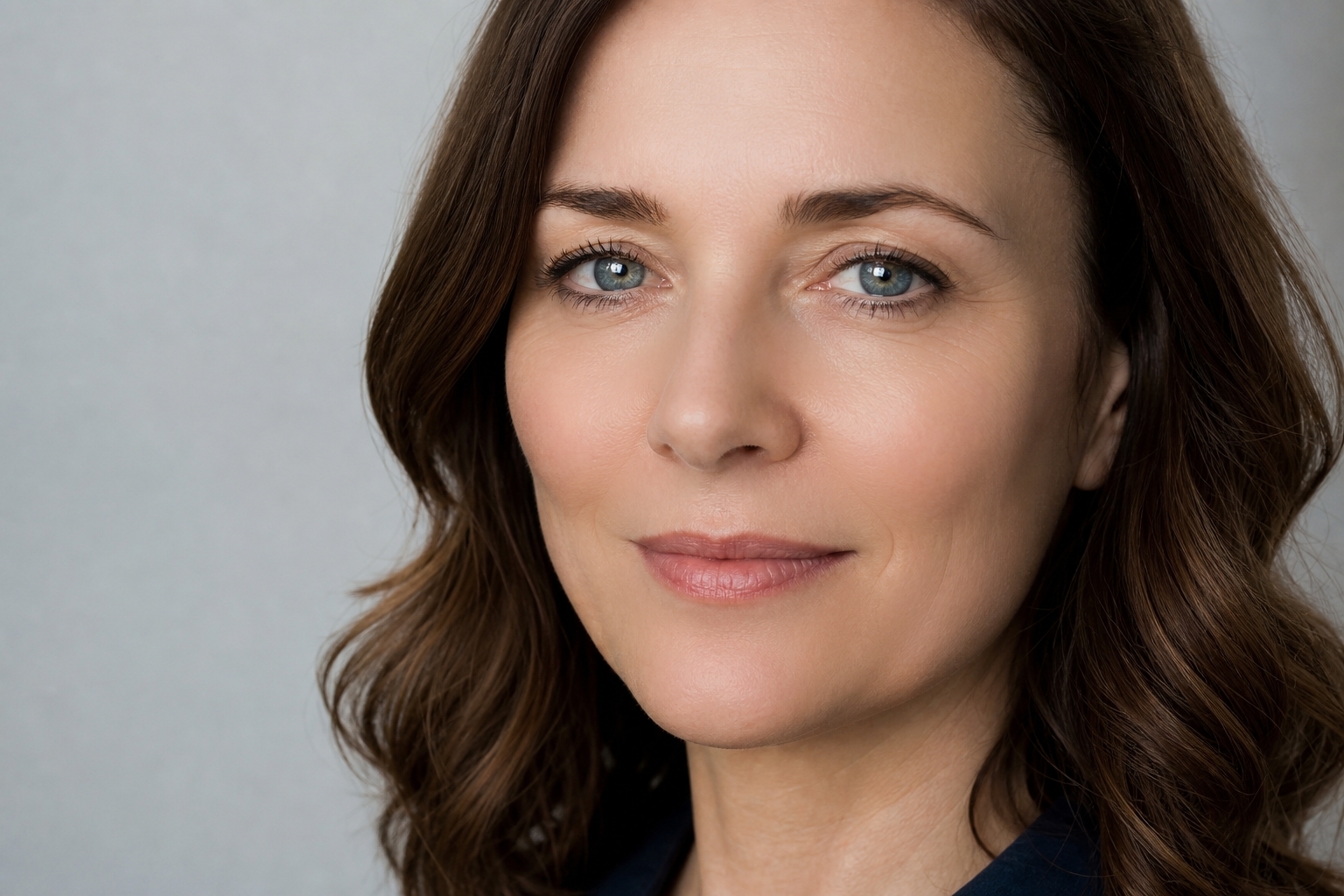 middle aged woman after retouching, smoother and even skin