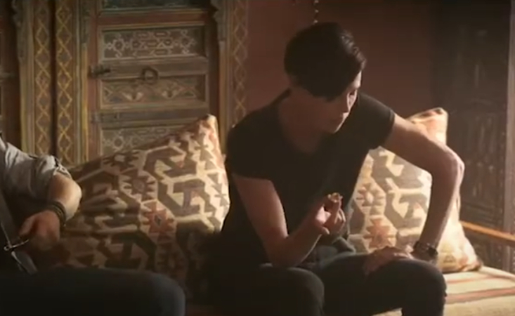 Andy eating Baklava in The Old Guard