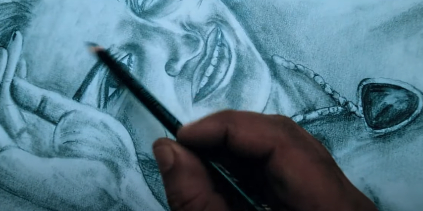 Jack drawing a picture of Rose in the Titanic