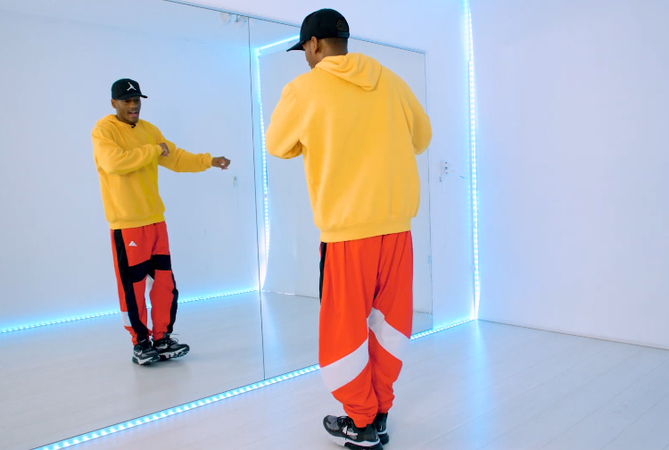 Rising slightly on toes in the Big Bank challenge video