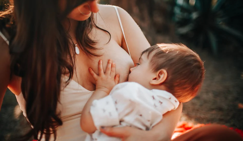 Baby biting breast