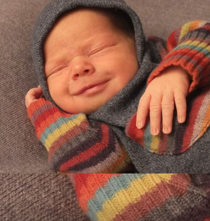 Is there a concern if my baby smiles during sleep
