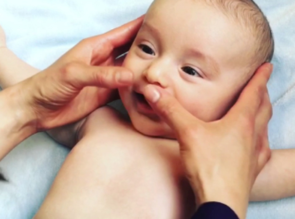Messaging baby gums to eas teething pain